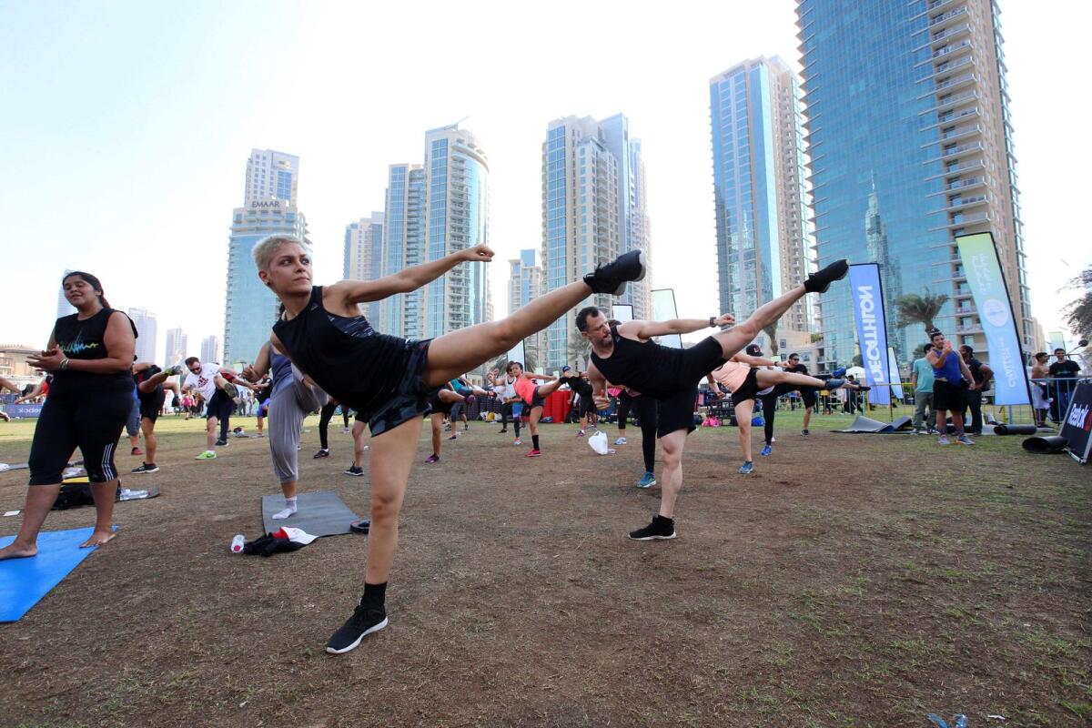 Participants take on the challenge with an intense Les Mills Body Combat session during the Dubai Fitness Challenge 30x30 at Burj Park, Downtown Dubai.